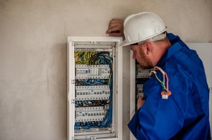 electrician-looking-into-electrical-panel